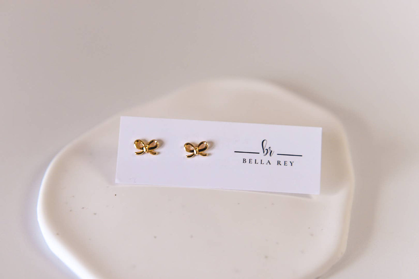 The Lela bow 18k gold plated stud earrings dainty