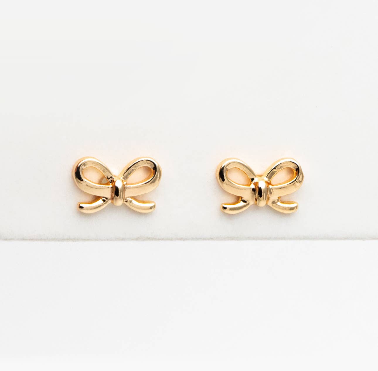 The Lela bow 18k gold plated stud earrings dainty